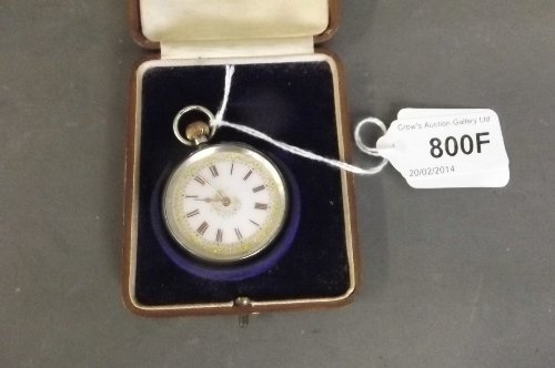 A 925 silver fob watch with an ornate enamelled gilt: A 925 silver fob watch with an ornate enamelled gilt face, boxed, 1¾'' diameter