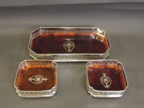 A pair of silver plate and faux tortoiseshell: A pair of silver plate and faux tortoiseshell decorative coasters with matching tray, 11'' x 5¾''