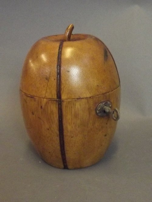 A treen tea caddy in the form of a melon, 6'' high: A treen tea caddy in the form of a melon, 6'' high