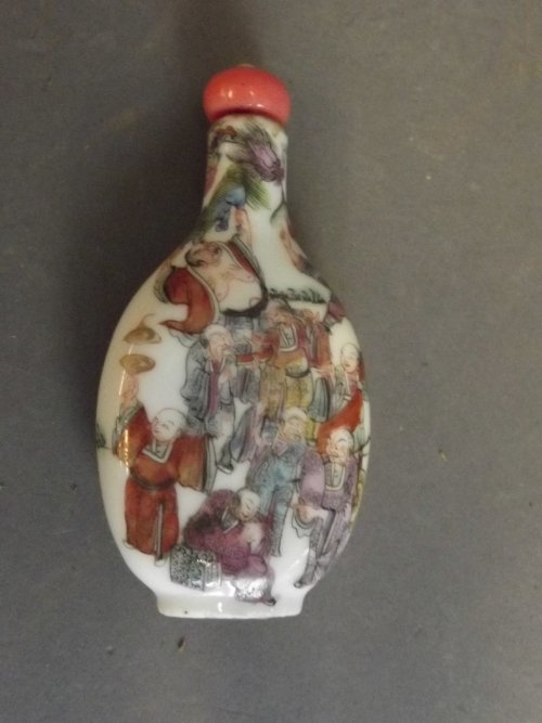 A C19th Chinese pottery snuff bottle painted with the: A C19th Chinese pottery snuff bottle painted with the Immortals, 4 character mark, 3¼'' high