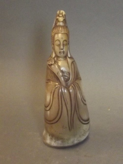 A large horn seal in the form of a robed deity, 6'': A large horn seal in the form of a robed deity, 6'' high