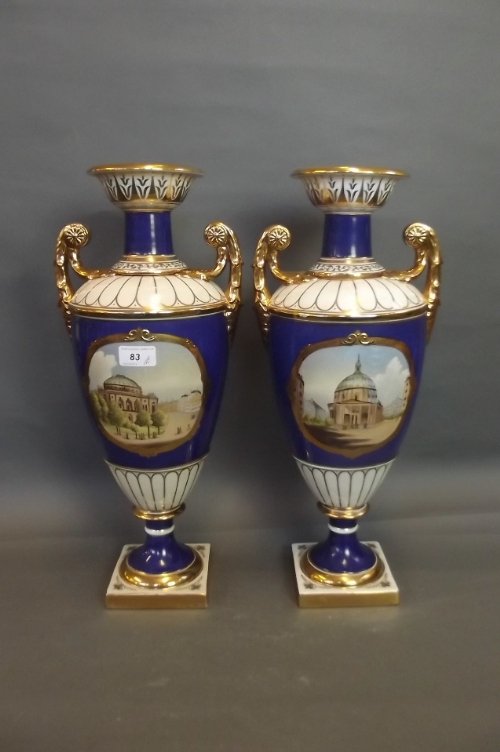 A pair of Russian style twin handled pottery vases: A pair of Russian style twin handled pottery vases painted with church scenes, 20'' high