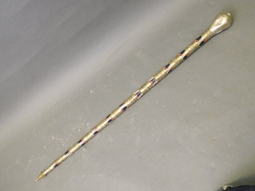 A Middle Eastern silver metal and gilt washed two: A Middle Eastern silver metal and gilt washed two section staff, inset with red and blue enamel decoration, 38'' long