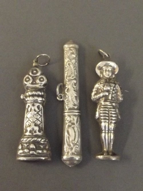 Three ornate Continental silver needle cases, 3'' long,: Three ornate Continental silver needle cases, 3'' long, 27g