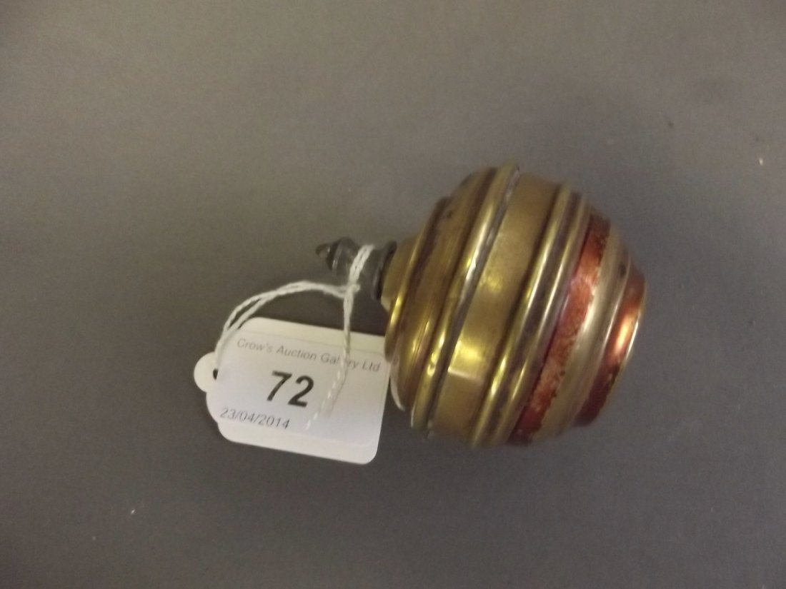 A C19th French brass cased pin cushion in the form of a: A C19th French brass cased pin cushion in the form of a spinning top, inscribed Toupie Brevetee SGDG, E.C.', 2½'' high