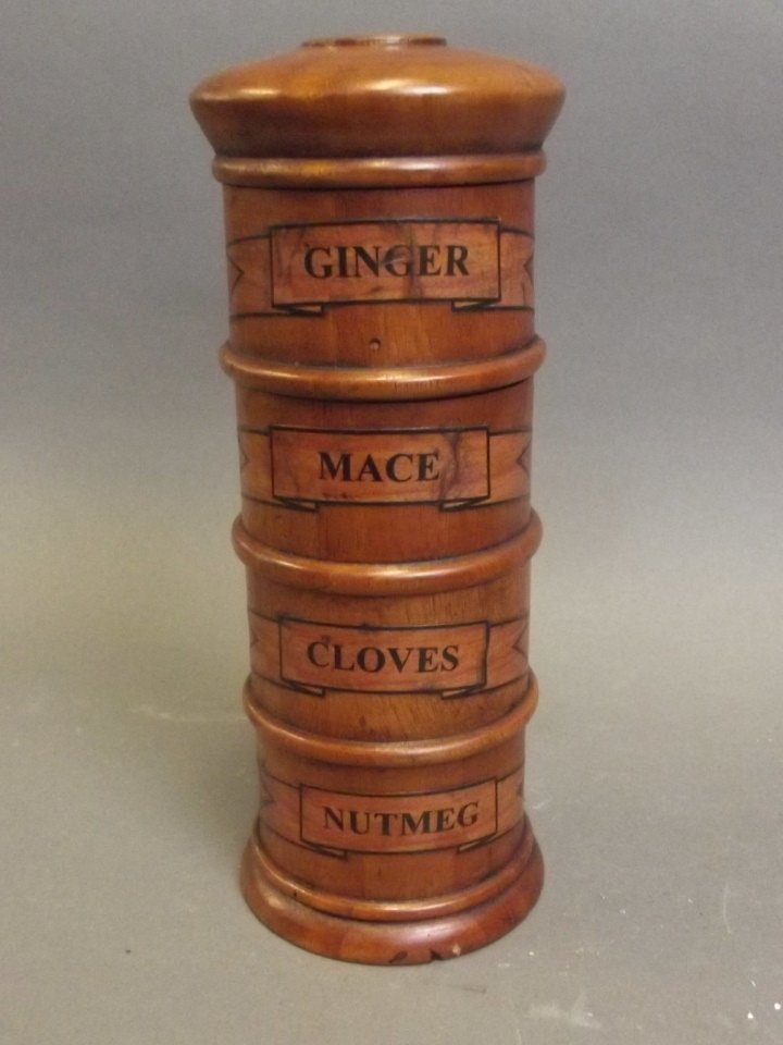 A treen spice tower with sections for ginger, mace,: A treen spice tower with sections for ginger, mace, garlic cloves, and nutmeg, 8'' high