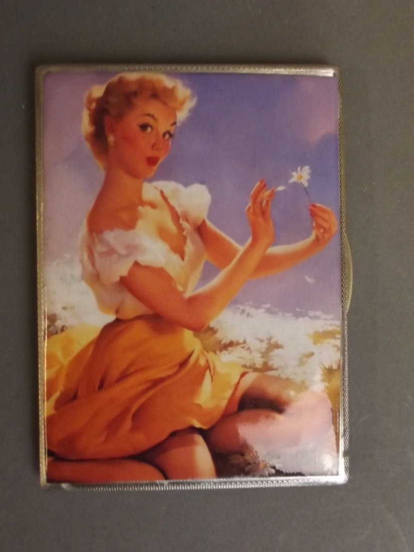 A Hallmarked silver engine turned cigarette case with: A Hallmarked silver engine turned cigarette case with later applied pictorial plaque of a pin up girl, London 1956, 3¼'' x 4½''