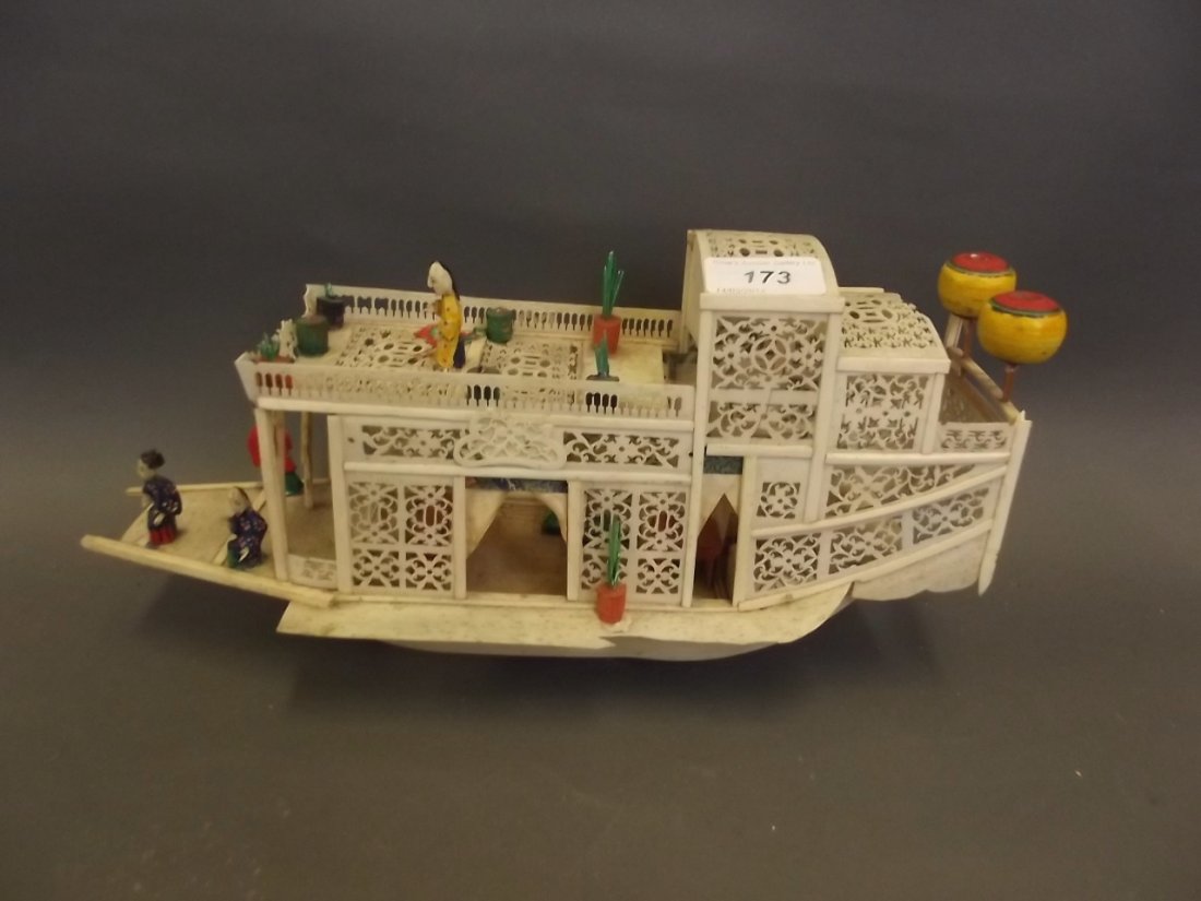 A C19th Chinese carved and pierced bone pleasure boat: A C19th Chinese carved and pierced bone pleasure boat decorated with figures, 13½'' wide