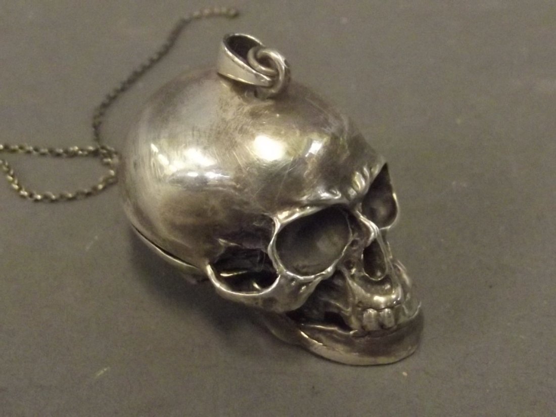A Continental silver snuff box in the form of a skull: A Continental silver snuff box in the form of a skull