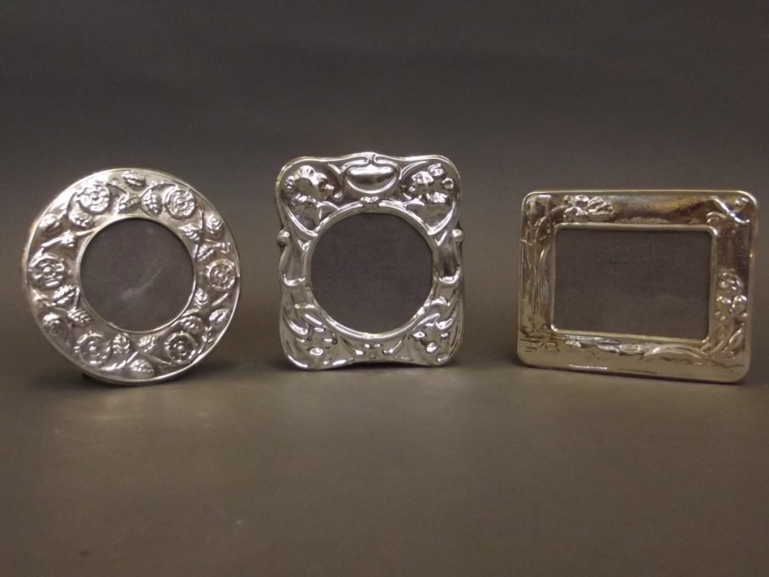 Three small Continental silver photo frames with Art: Three small Continental silver photo frames with Art Deco style floral relief decoration