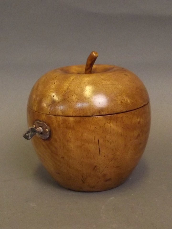 A treen tea caddy in the form of an apple, 5'' high: A treen tea caddy in the form of an apple, 5'' high