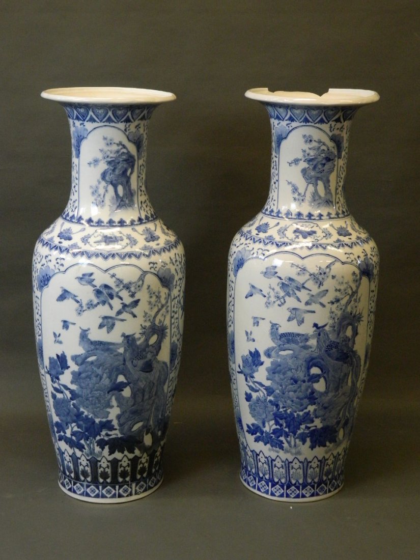 A large pair of Chinese floor vases with blue and white