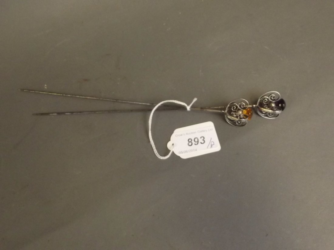 A pair of ornate Hallmarked silver hat pins, 9'' long: A pair of ornate Hallmarked silver hat pins, 9'' long