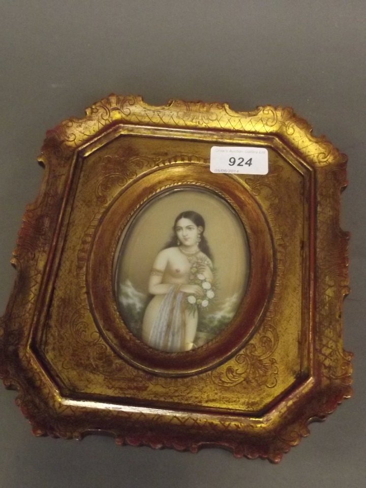 A superb C19th Indian oval miniature painting,: A superb C19th Indian oval miniature painting, semi-naked maiden holding flowers, in a gilt frame, image 4¼'' x 3¼''