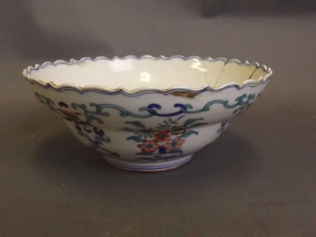 A Chinese C19th porcelain bowl with shaped rim,: A Chinese C19th porcelain bowl with shaped rim, decorated in the Doucai palette, seal mark to base, 6¾'' diameter (AF)
