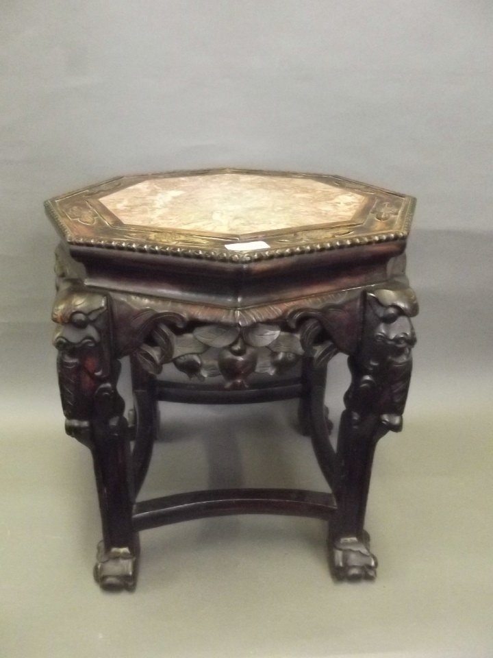 A C19th Chinese carved hardwood jardinière stand with: A C19th Chinese carved hardwood jardinière stand with marble inset top, 17'' diameter, 18'' high