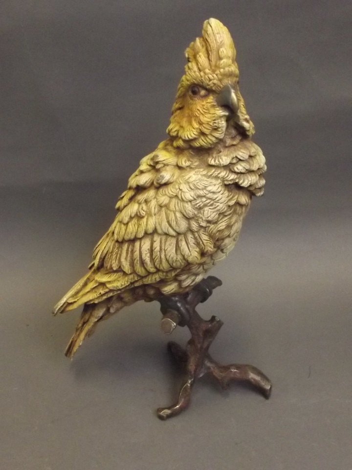 A Vienna style cold painted bronze figure of a cockatoo: A Vienna style cold painted bronze figure of a cockatoo perched on a branch, impressed 'B' and Geschutzt, 12'' high