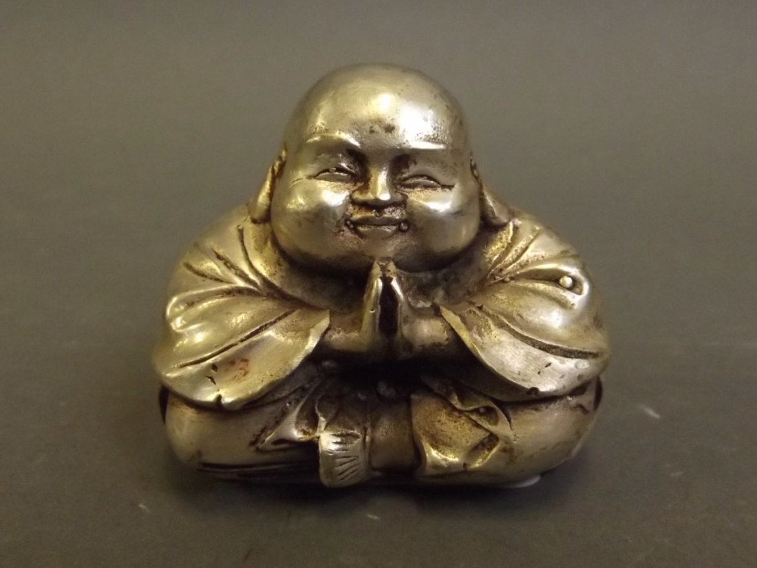 A Chinese silvered metal figure of Buddha seated, 2'': A Chinese silvered metal figure of Buddha seated, 2'' high