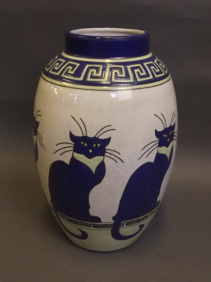 An Art Pottery vase with stylised decoration of a cat,: An Art Pottery vase with stylised decoration of a cat, 11'' high