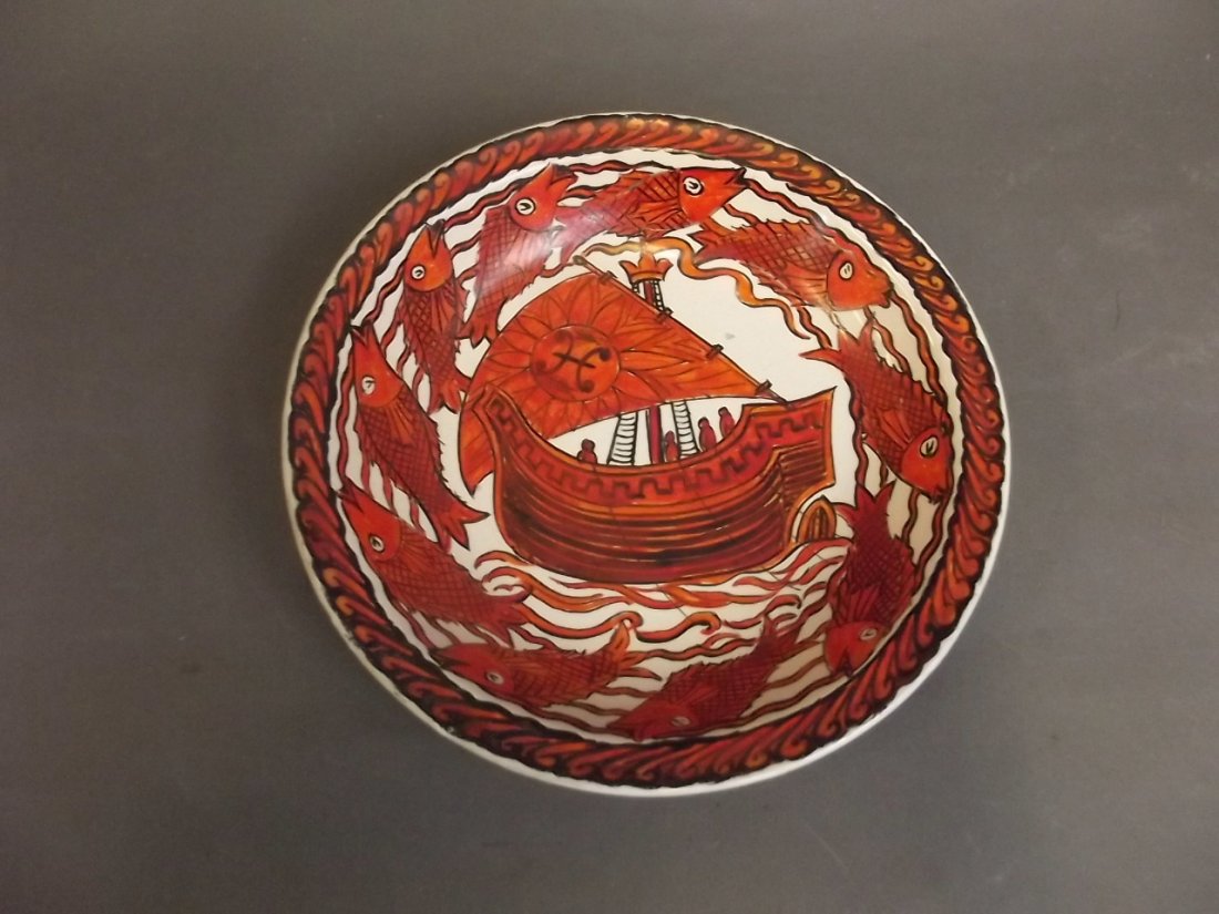 A William De Morgan pottery dish painted by John: A William De Morgan pottery dish painted by John Pearson, with a central galleon and an outer frieze of fish, 8?'' diameter