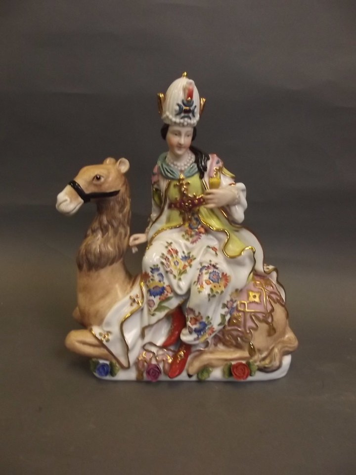 A large Continental pottery figure of a dignitary on a: A large Continental pottery figure of a dignitary on a camel, 11½'' high