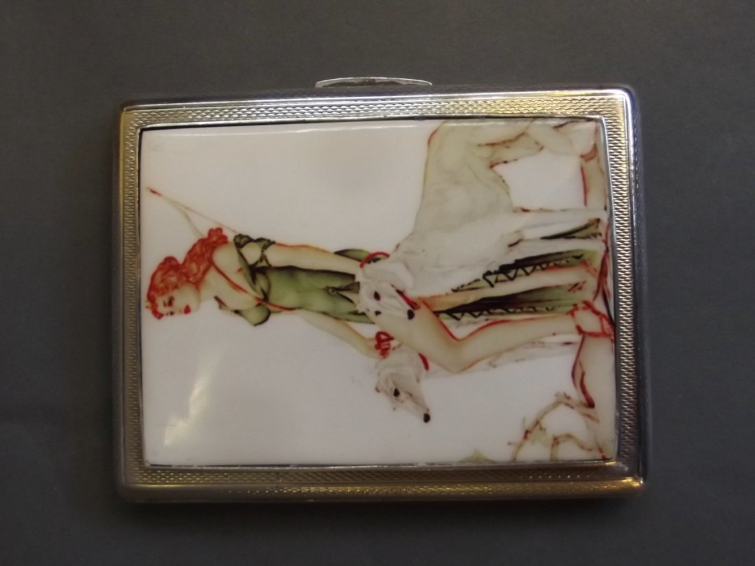 A silver engine turned cigarette case with later: A silver engine turned cigarette case with later applied cold enamel plaque depicting a huntress with companion dogs, Birmingham 1935, 2½'' x 3¼''