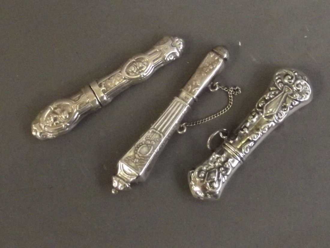 Three Continental silver needle cases, 2¾'' long: Three Continental silver needle cases, 2¾'' long