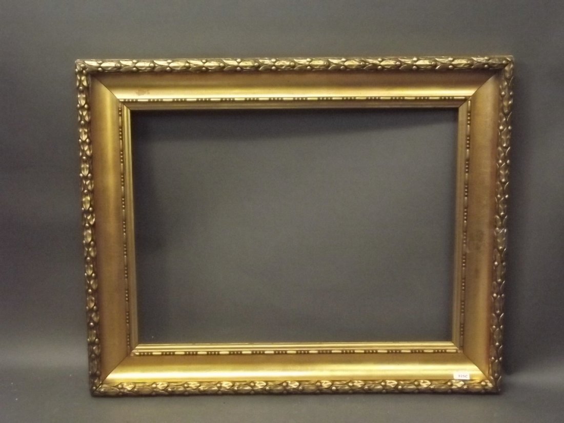 A late C19th Continental giltwood and composition frame: A late C19th Continental giltwood and composition frame with laurel and berry border, and bead and ball matchings, rebate 31½'' x 23½''