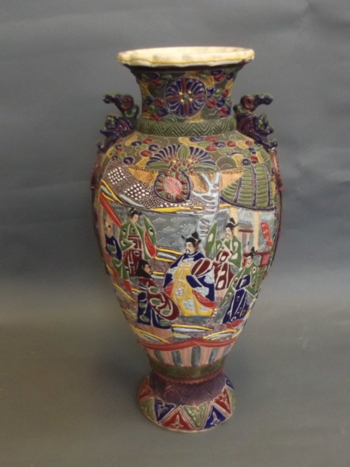 A large Japanese Satsuma polychrome enamel vase with: A large Japanese Satsuma polychrome enamel vase with decorative panels depicting men in kimonos, 19'' high