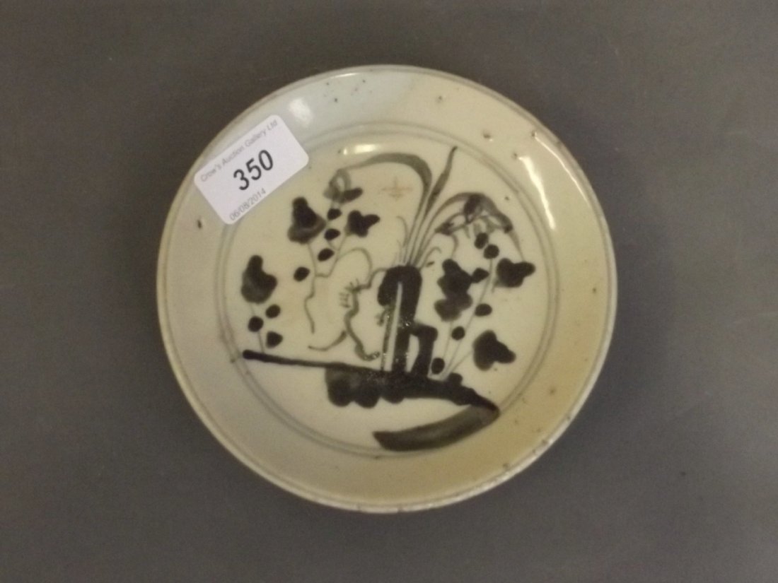 A Chinese Ming Period green painted pottery shallow: A Chinese Ming Period green painted pottery shallow dish, 6'' diameter
