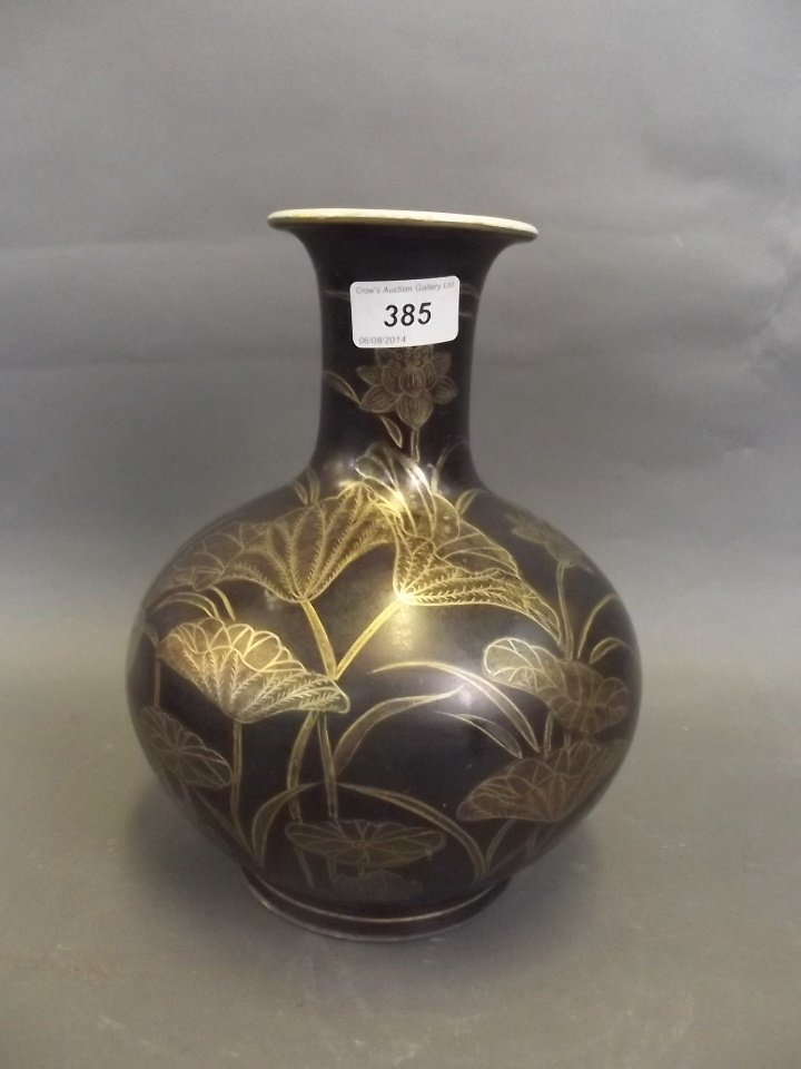 An early C20th Japanese black ground pottery vase: An early C20th Japanese black ground pottery vase painted in gilt with water lilies, 9½'' high, Best Bid