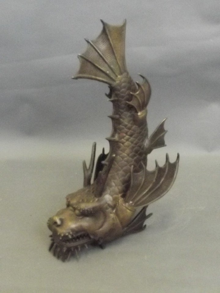 A bronze figure of an articulated dragonfish, 13'' high: A bronze figure of an articulated dragonfish, 13'' high