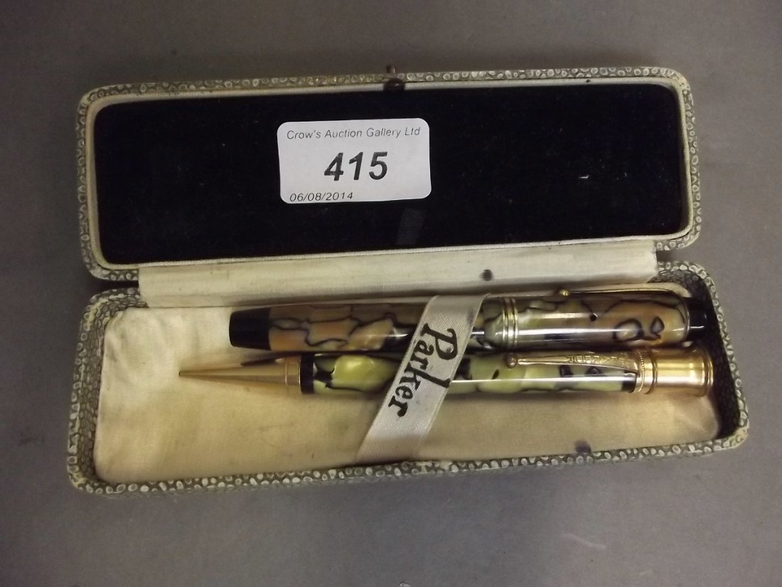 A 1930s Park Duofold fountain pen and matching: A 1930s Park Duofold fountain pen and matching ballpoint, pat. 5.16, with marbled pearlescent bodies in a faux shagreen case