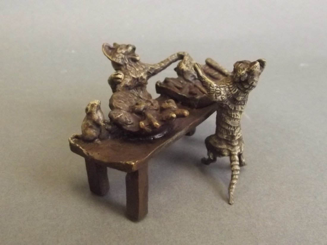 A Vienna style cold painted bronze market stall manned: A Vienna style cold painted bronze market stall manned by cats selling vegetables, impressed 'B' to base, 3'' long