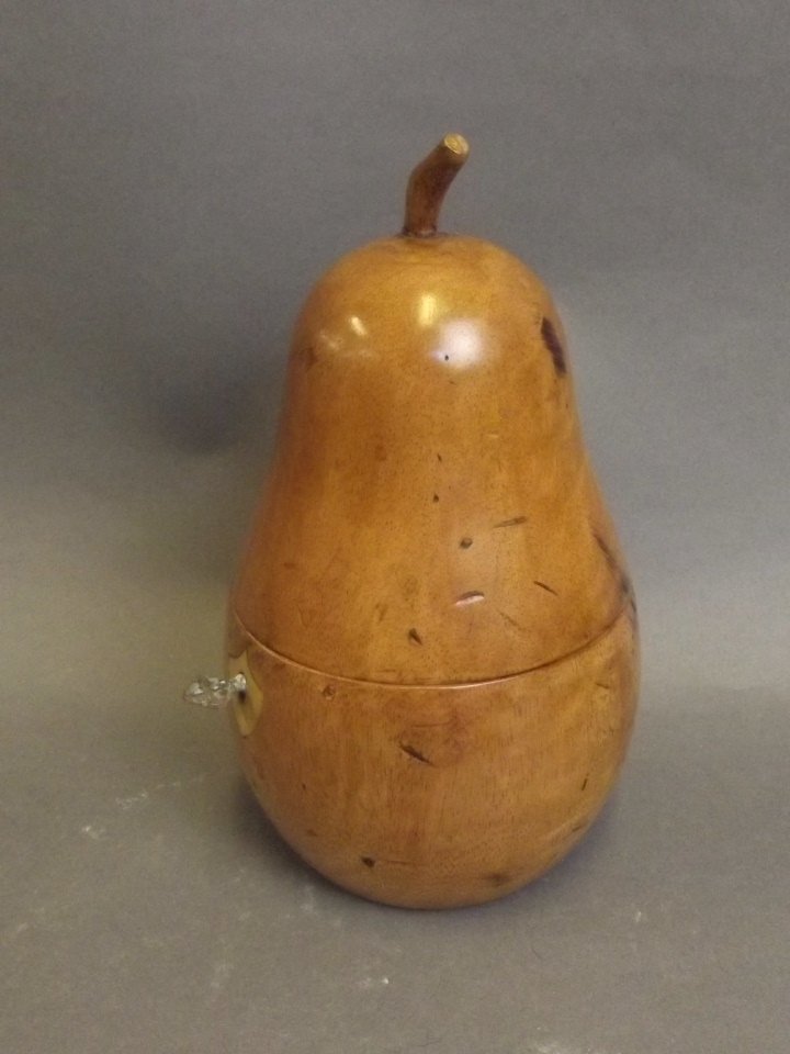 A treen tea caddy in the form of a pear, 7½'' high: A treen tea caddy in the form of a pear, 7½'' high