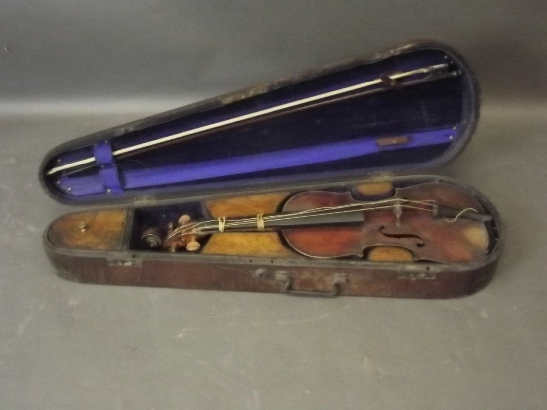A C19th violin labelled Joseph Hare of Golden Violin,: A C19th violin labelled Joseph Hare of Golden Violin, St. Pauls Churchyard, London, with bow and case, violin 23½'' long (AF)