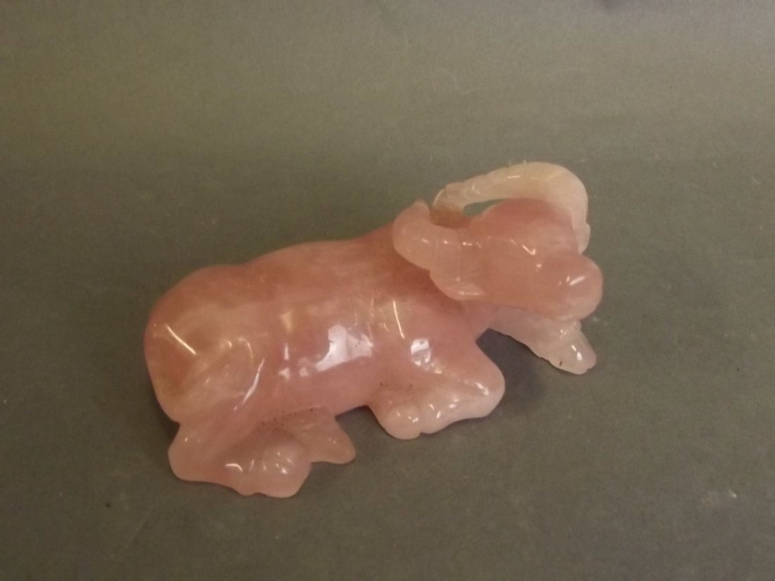 A Chinese carved hardstone model of a reclining water: A Chinese carved hardstone model of a reclining water buffalo, 3½'' wide