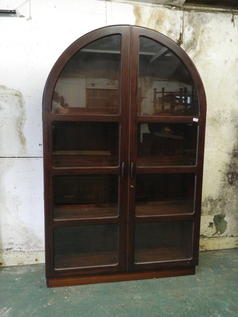 A 1970's Dyrlund Danish rosewood domed top display: A 1970's Dyrlund Danish rosewood domed top display cabinet, 47'' wide, 15½'' deep, 75'' high