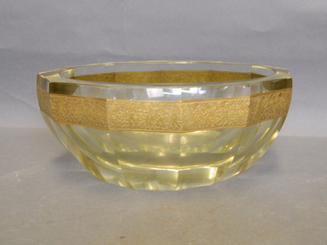 A heavy Art Deco glass bowl with an engraved metal rim,: A heavy Art Deco glass bowl with an engraved metal rim, marked 'Moser', 9'' diameter