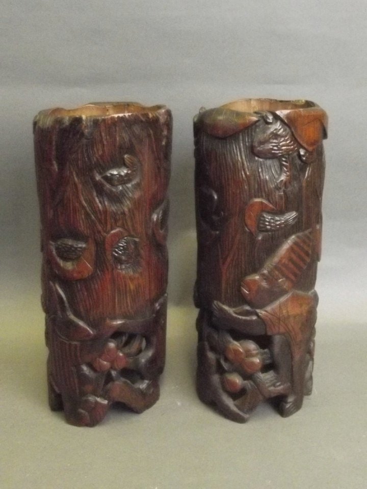 A pair of Chinese bamboo brushpots with carved: A pair of Chinese bamboo brushpots with carved decoration of monkeys, rabbits and frogs, 12'' high