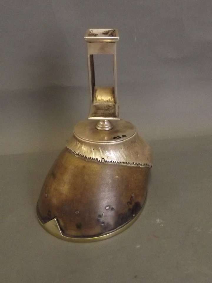 A silver plated horse's hoof mounted with a silver: A silver plated horse's hoof mounted with a silver plated match box holder, inscribed Skylark, 7'' high