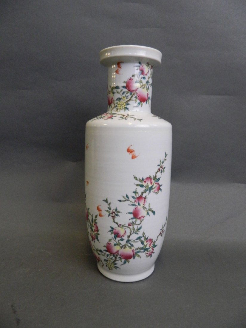 A Chinese porcelain vase with enamel decoration of bats: A Chinese porcelain vase with enamel decoration of bats and a fruiting tree bearing peaches, 11½'' high