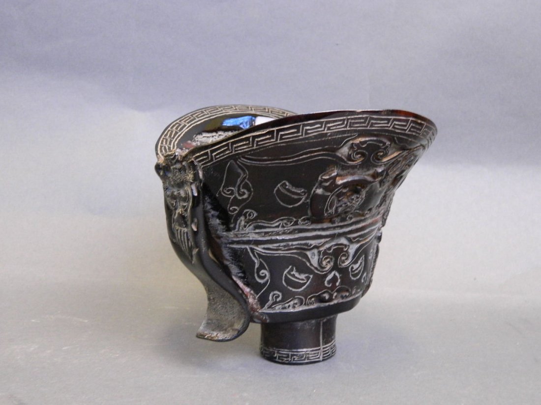 A horn libation cup carved with bats and kylin, 5'': A horn libation cup carved with bats and kylin, 5'' high