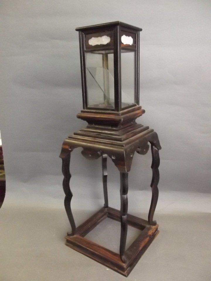 A C19th Chinese carved coromandel lantern on stand with: A C19th Chinese carved coromandel lantern on stand with silk panels, 10'' square, 28½'' high