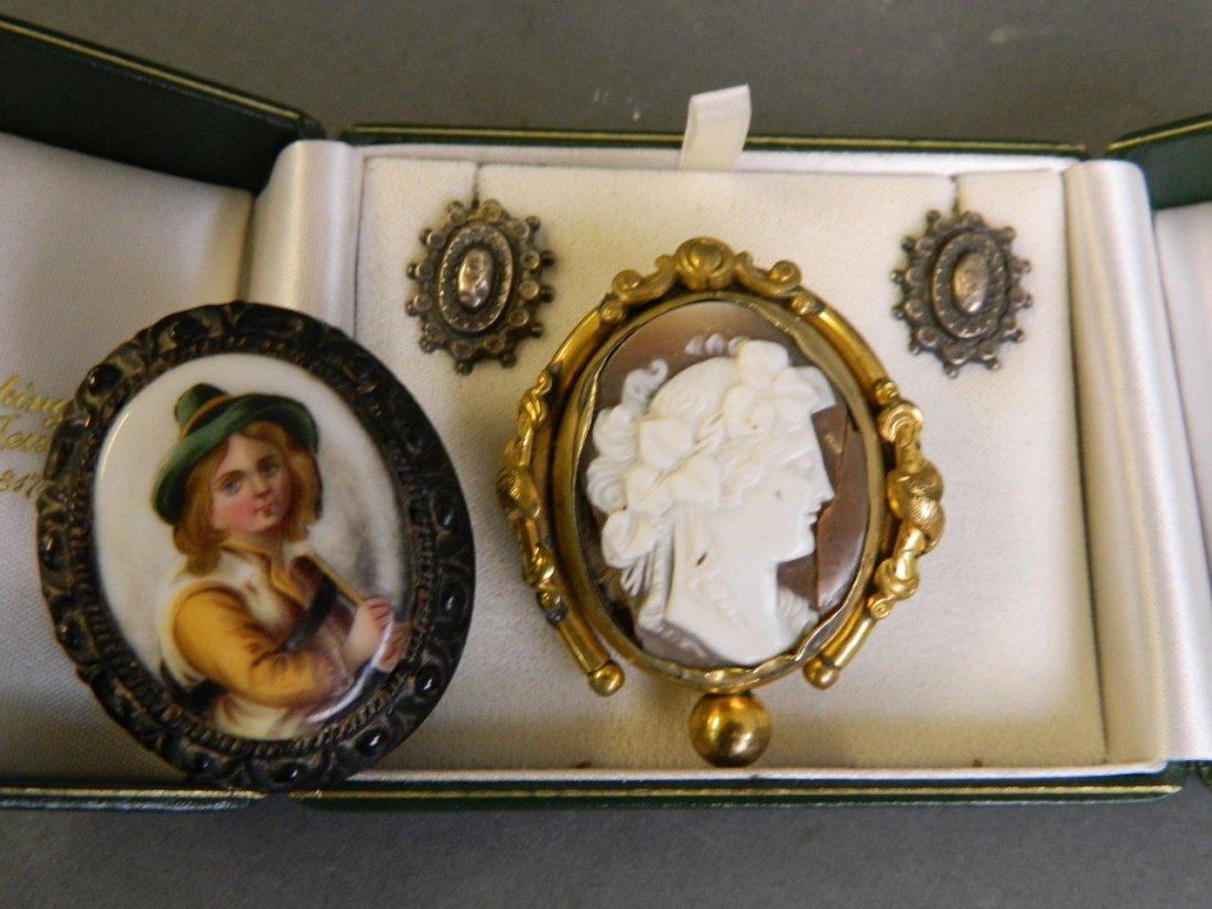A Victorian cameo swivel brooch, an enamelled brooch,: A Victorian cameo swivel brooch, an enamelled brooch, and a pair of silver earrings, 2'' long