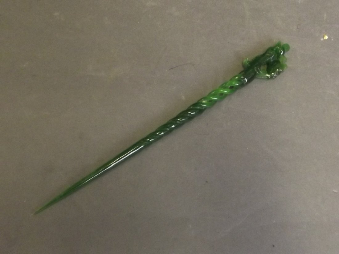 A Chinese carved and pierced hardstone hair pin, 9½'': A Chinese carved and pierced hardstone hair pin, 9½'' long