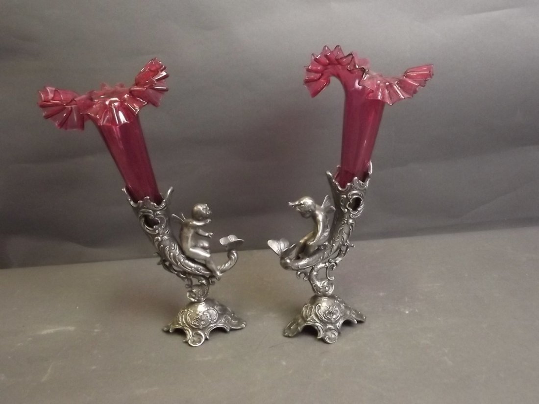 A pair of plated metal epergnes with ruby glass liners,: A pair of plated metal epergnes with ruby glass liners, 10'' high