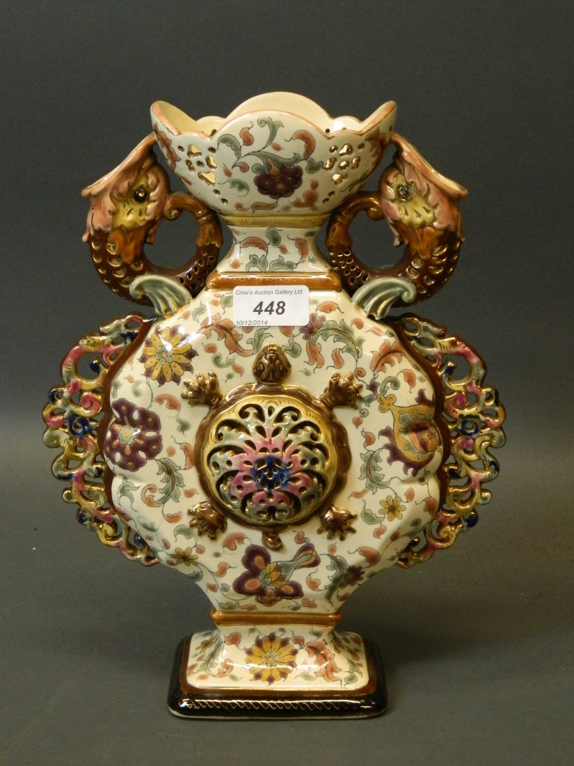 A late C19th Zsolnay style vase with twin dolphin: A late C19th Zsolnay style vase with twin dolphin handles and pierced and enamelled decoration, marked Znaim, 12½'' high