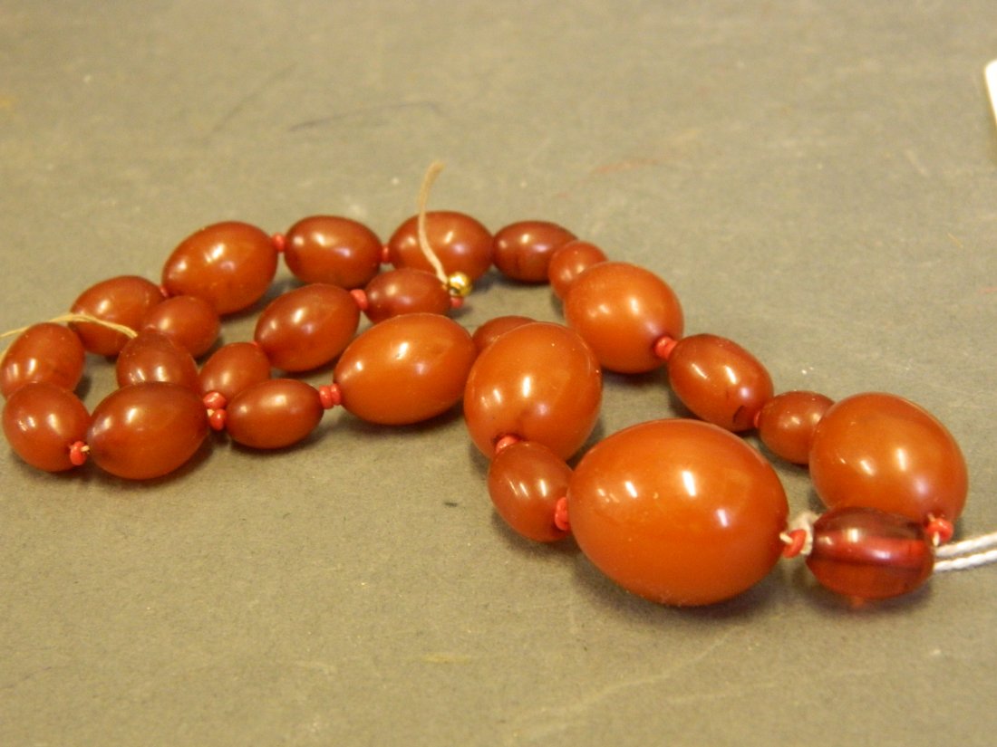 A graduated amber bead necklace, largest bead 20mm (AF): A graduated amber bead necklace, largest bead 20mm (AF)