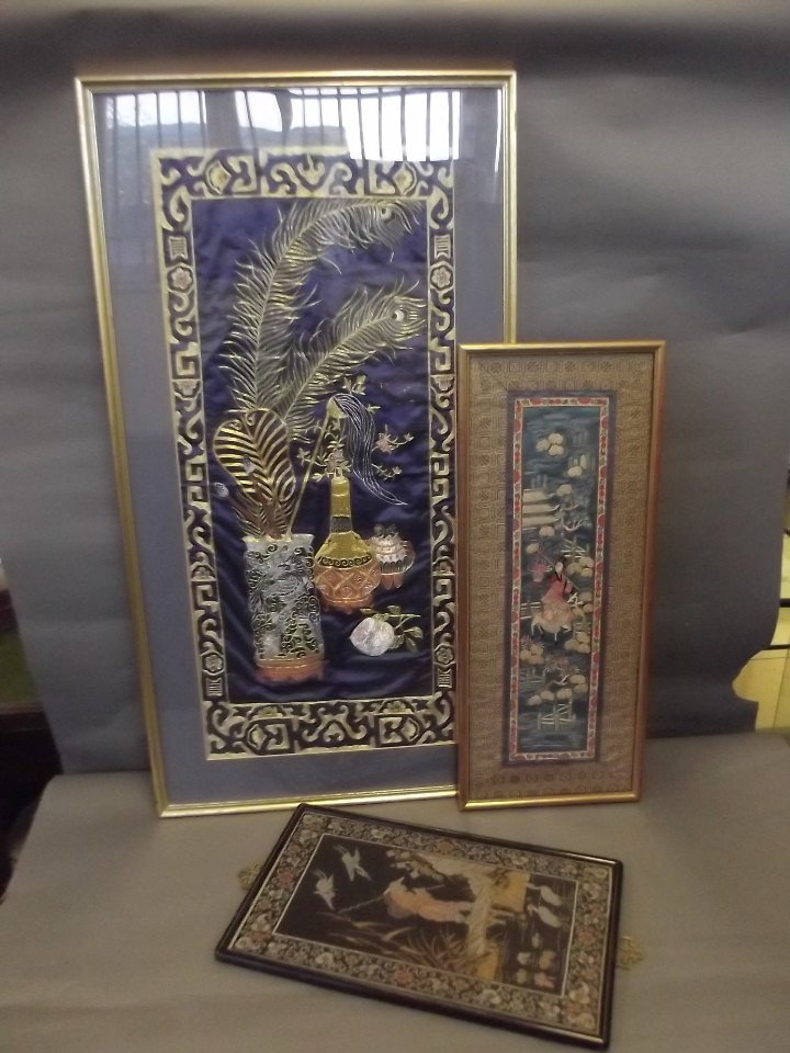 Three framed Oriental embroideries decorated with: Three framed Oriental embroideries decorated with figures and birds, 31'' x 14''